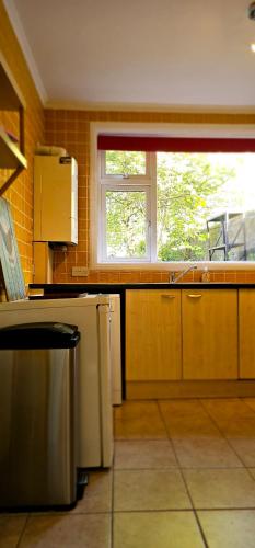 a kitchen with a counter and a window in it at Home away from home in Aberdeen