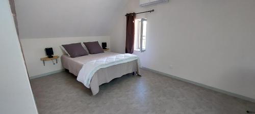 Katil atau katil-katil dalam bilik di Appartement Pesmes