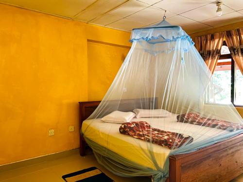 Postel nebo postele na pokoji v ubytování Omi Relax Inn