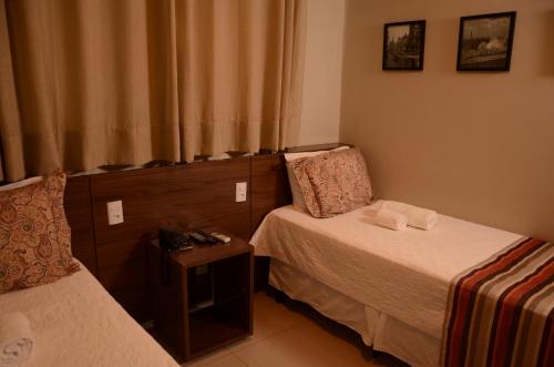 Postel nebo postele na pokoji v ubytování Ideali Hotel