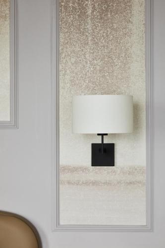 a lamp on a wall next to a window at The Grand Brighton in Brighton & Hove