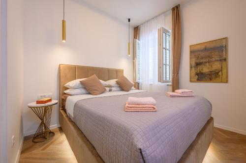 Postel nebo postele na pokoji v ubytování Jupiter Luxury Accommodation