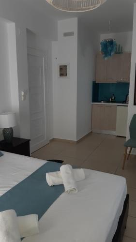 Кровать или кровати в номере Filia Apartments