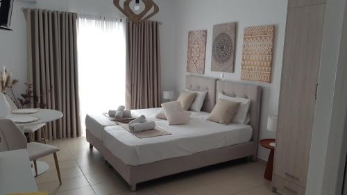 Кровать или кровати в номере Filia Apartments