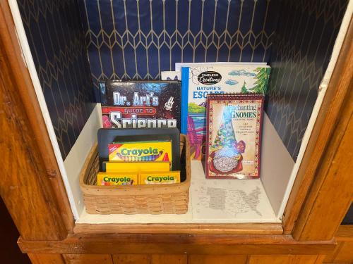 a drawer filled with books and other items at Skyline Village Inn in Spruce Pine