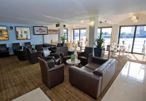 a living room filled with furniture and a large window at The Dolby Hotel Liverpool - Free city centre parking in Liverpool
