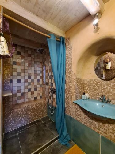 a bathroom with a tub and a sink and a shower at Stonehome Pojata in Rušići