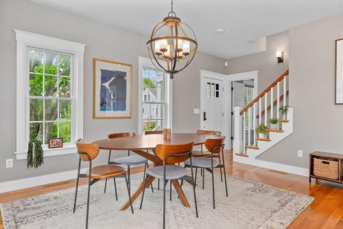 a dining room with a table and chairs at 19 State Street Sandwich - Marsh Mellow in Sandwich