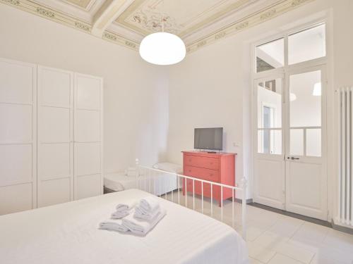 Postel nebo postele na pokoji v ubytování Medusa Apartment - Affresco
