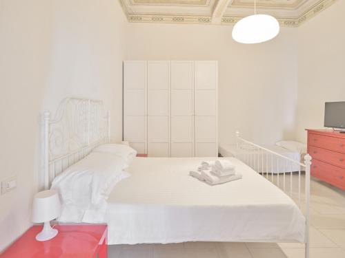 Postel nebo postele na pokoji v ubytování Medusa Apartment - Affresco