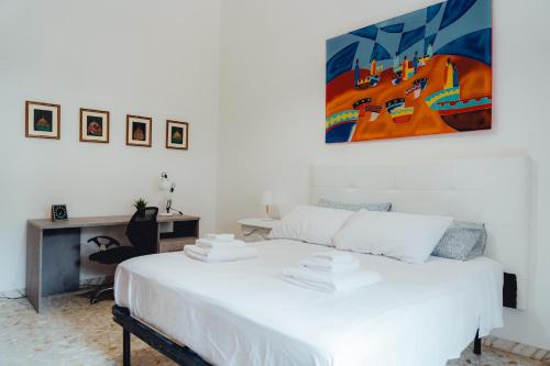 Ένα ή περισσότερα κρεβάτια σε δωμάτιο στο Casa Mandarino con Parcheggio
