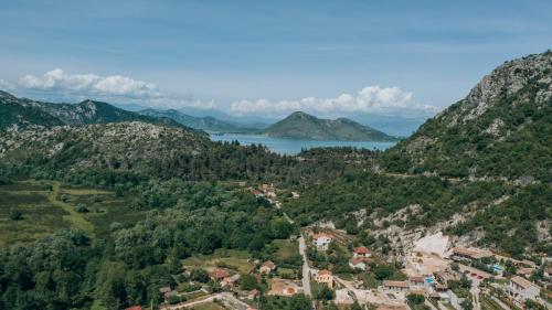 an aerial view of a village in the mountains at Ethno Lodge AB in Virpazar