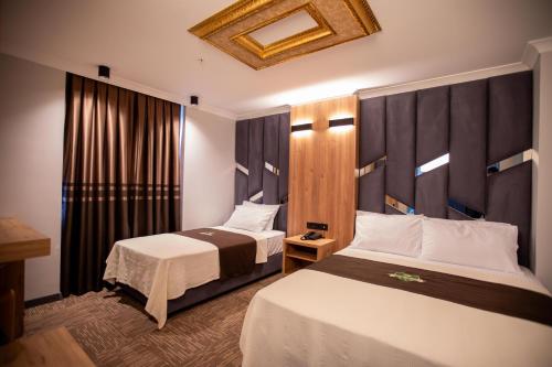 Ένα ή περισσότερα κρεβάτια σε δωμάτιο στο Hotel Milano