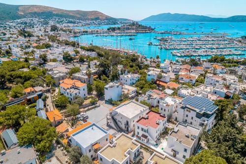 an aerial view of a city with a harbor at NewOld Flat in Bodrum City