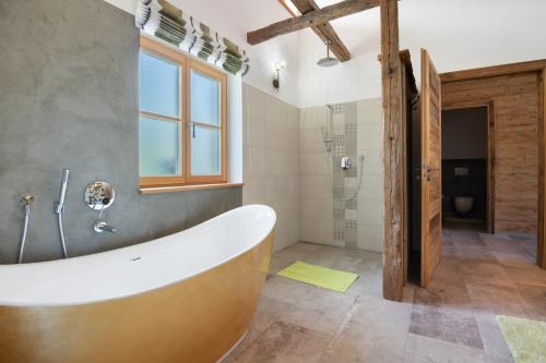a large bathroom with a tub and a shower at Bergchalet 3 in Freyung