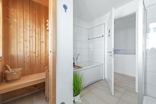 a bathroom with a shower and a sink at Palstek in Olpenitz