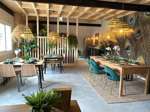 a dining room with a long table and chairs at Tibo - Casal do Conde in Caldas de Reis