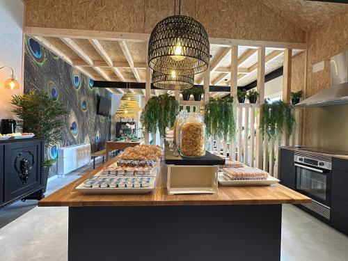 a kitchen with a counter with food on it at Tibo - Casal do Conde in Caldas de Reis