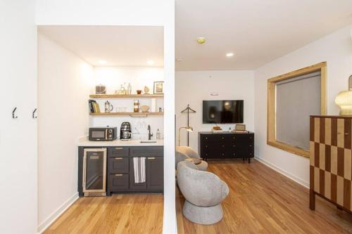 two images of a kitchen and a living room at Historic Downtown Studio, Walk to Bathhouses, Room # 100 in Hot Springs