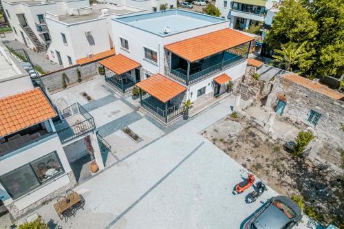 an overhead view of a large white house with an orange roof at NewOld Flat in Bodrum City