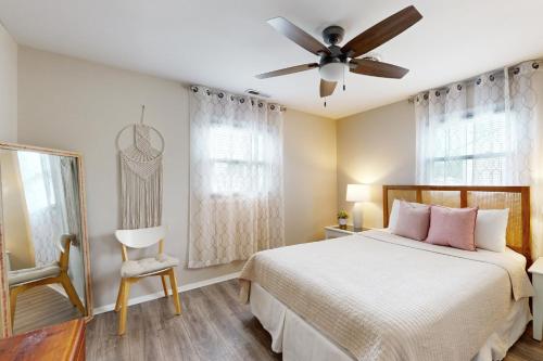 a bedroom with a bed and a ceiling fan at Dockside Daydreamin' in Ocean City
