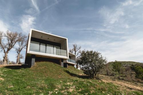 a house on top of a hill at Pachán Dehesa Boyal in Cuenca