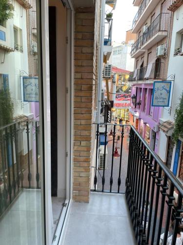 a hallway of a building with a black fence at Boomerang in Benidorm