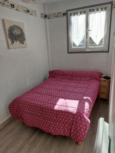 Ένα ή περισσότερα κρεβάτια σε δωμάτιο στο Appartement F2 situé à Amélie les Bains - Boulevard de la petite Provence