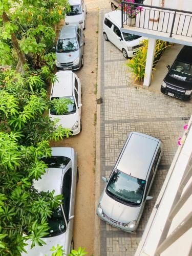 an overhead view of cars parked in a parking lot at Hotel Siyathma polonnaruwa in Polonnaruwa