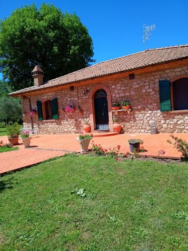 a stone building with a yard in front of it at B&B Maison Brunetti in Boiano