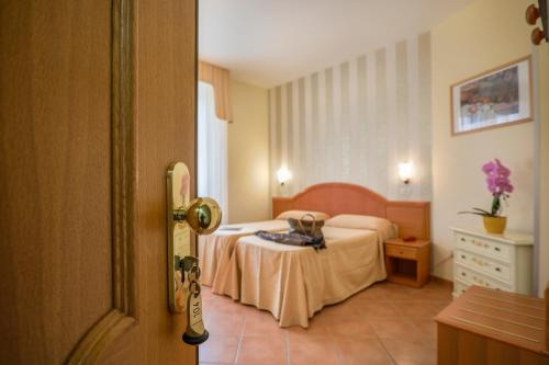 Posteľ alebo postele v izbe v ubytovaní Hotel Katy