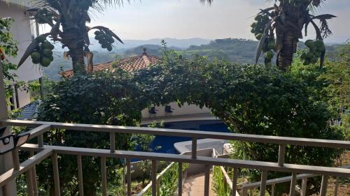 a view from the balcony of a house with trees at Villa Garita Inn in La Garita