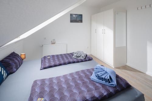a attic room with two bean bags on the floor at Haus Enna Enna 2 in Norderney