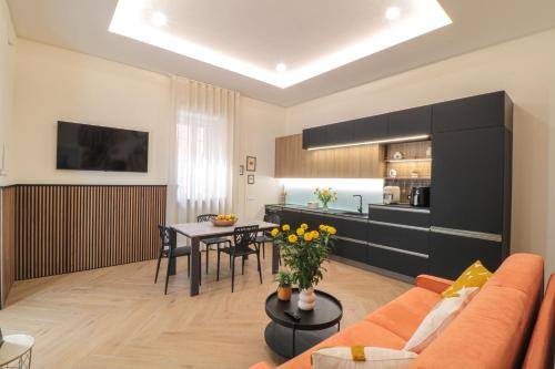 a living room with a couch and a table at Dimora Gioia in Ercolano