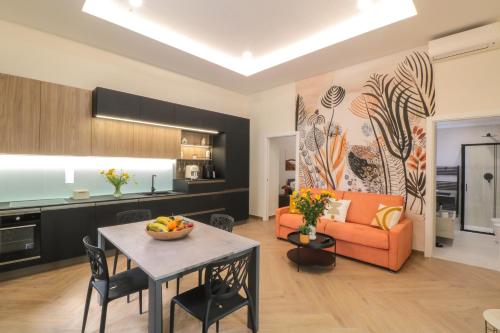 a living room with a table and a couch at Dimora Gioia in Ercolano