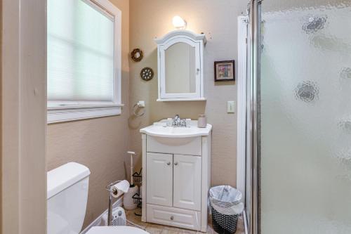 a white bathroom with a sink and a shower at On-Site River Access Quiet Home in Wilseyville! in Wilseyville