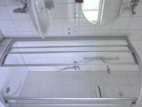 a bathroom with a sink and a mirror at Ferienwohnung MH2 "Sunrise" in Rostock