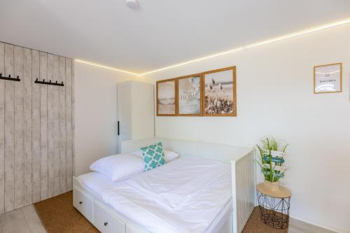 Ένα ή περισσότερα κρεβάτια σε δωμάτιο στο Ferienwohnung Kleiner Sandloper