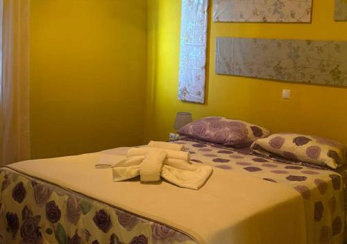 a bed with a towel on top of it at Villa Baleia Stella Maris Exclusive in Calheta Do Maio