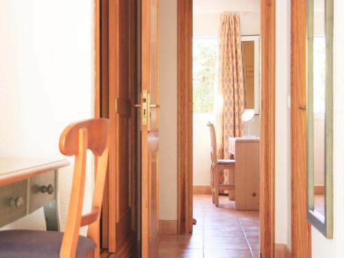 a room with a door open to a dining room at Casa Rainer in Es Figueral Beach