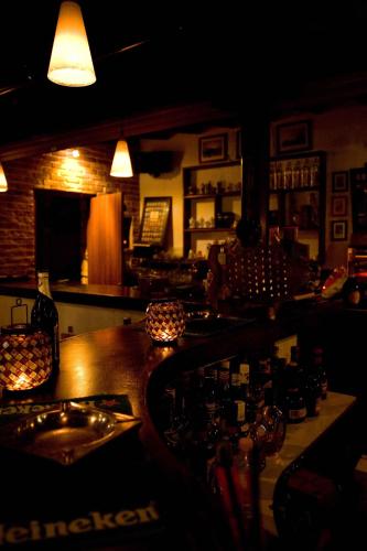 a bar with a counter and a sink in a room at Oasis Beach Hotel in Skala