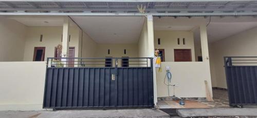 a building with a gate in front of it at Homs in Kuta