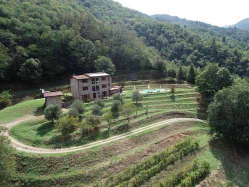 an aerial view of a house on a hill at Casa Bachella in Bagni di Lucca