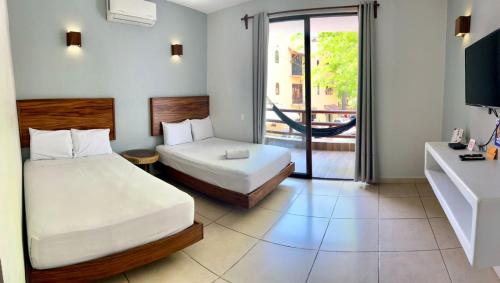 Postel nebo postele na pokoji v ubytování Hotel Aldea Sol