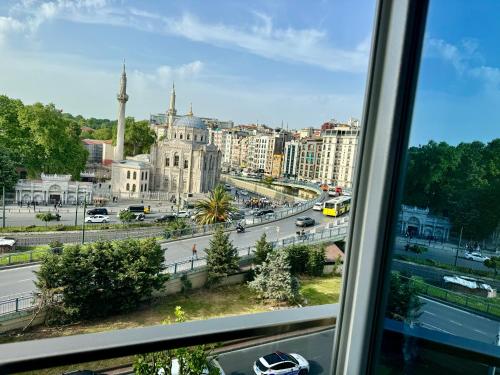 a view of a city from a window at Aram Edessa Hotel in Istanbul