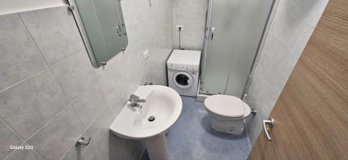 a small bathroom with a toilet and a sink at Bella Sorella View in Pizzo