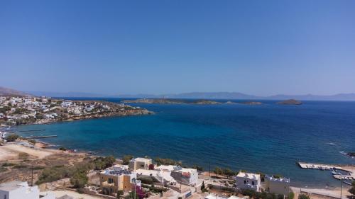an aerial view of a city and the ocean at Aegeans Eye in Azolimnos