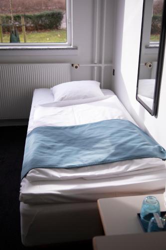 Postel nebo postele na pokoji v ubytování Hotel Strandparken