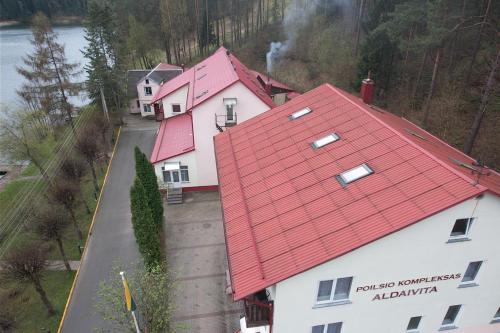 an overhead view of a house with a red roof at Svečių namai ALDAIVITA in Ignalina