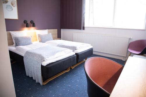 Postel nebo postele na pokoji v ubytování Hotel Strandparken